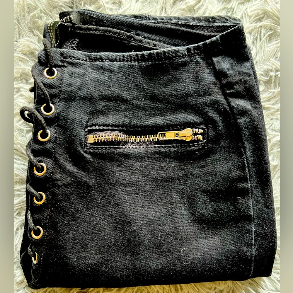Black jeans high rise size 27 with zippers on the side.